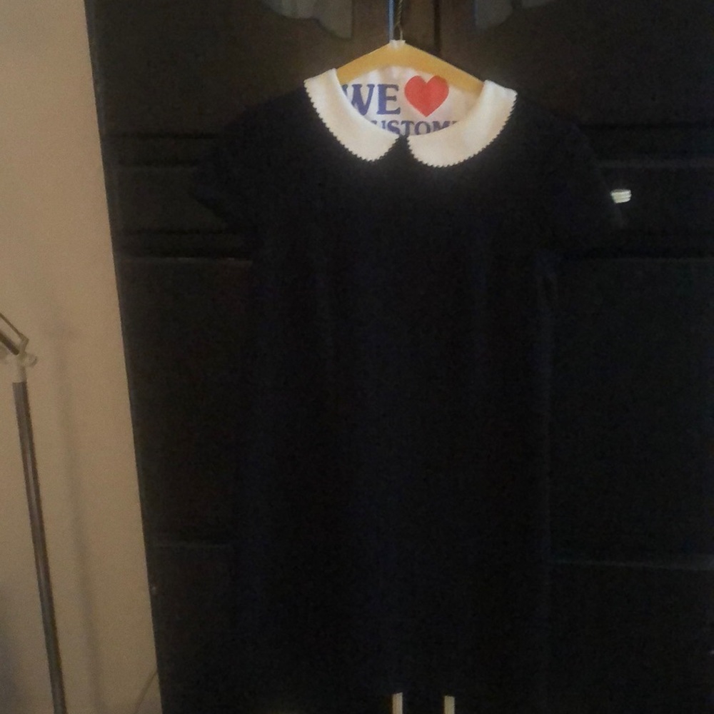 Baby doll style dress with back cutout.